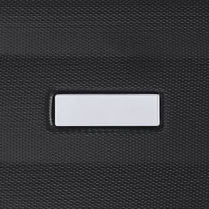 A close-up of a textured black surface featuring a rectangular area, presumably for a label or branding.