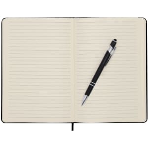 A black notepad with lined pages and a silver-accented black pen resting on the left page.