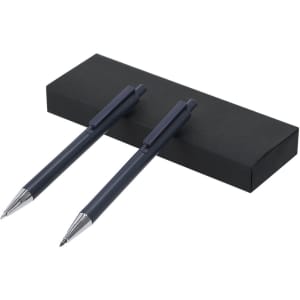 A set of two dark blue metal pens displayed in a black box, featuring logo branding on the pens.