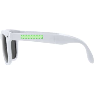 A pair of white sunglasses with dark lenses and a logo on the side.