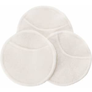 Three round, white facial cleansing pads with a soft texture, featuring a simple design.