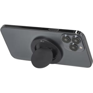 A black phone stand mounted on the back of a smartphone, featuring a circular grip and a logo.