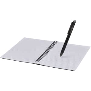 An open, spiral-bound notebook with white lined pages and a black erasable pen resting on it.