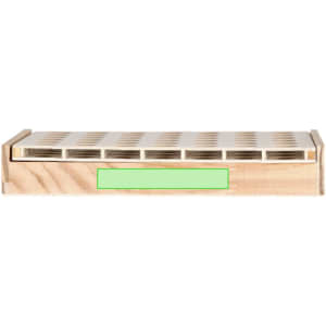 A wooden game board with a light wood finish and a green label, featuring a grid design for game pieces.