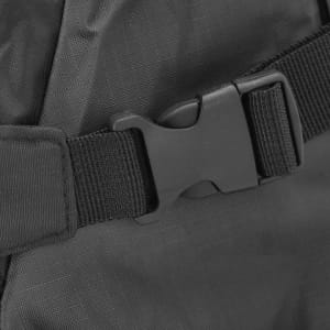 A close-up of a black backpack strap featuring a plastic buckle for secure fastening.
