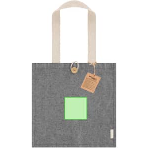 A grey tote bag with beige handles, featuring a square green panel and a decorative tag. It has a logo on it.