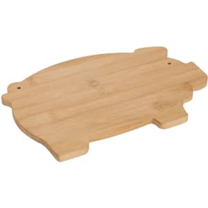 A bamboo cutting board shaped like a pig, featuring a simple design and a small logo.