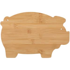 A bamboo cutting board in the shape of a pig, featuring a natural wood finish and a small hole for hanging.