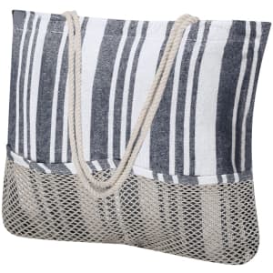 A striped toiletry bag in navy and white with a mesh bottom and natural rope handles.