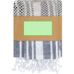 A folded blue and white patterned towel wrapped in a paper band. The towel features fringed ends.