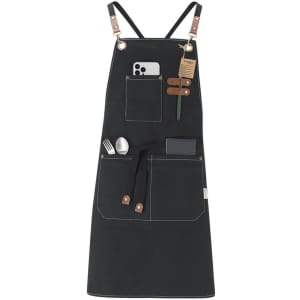 A black Fonor apron featuring multiple pockets, leather accents, and a logo, suitable for workwear use.