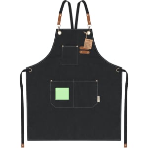 A black apron with leather accents and three pockets, featuring a small green square. It has adjustable straps and a logo.