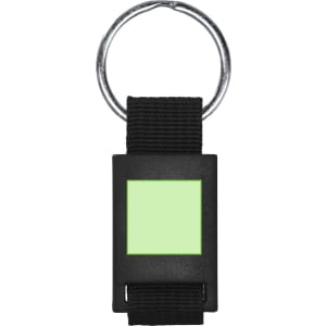 A black keyring featuring a square green section, attached to a metal ring.