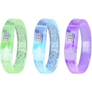 Three glowing bracelets in green, blue, and pink, featuring a sparkly design and a branding logo.