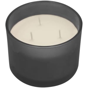 A round, grey aromatic candle with three wicks and a white wax interior in a glass container.