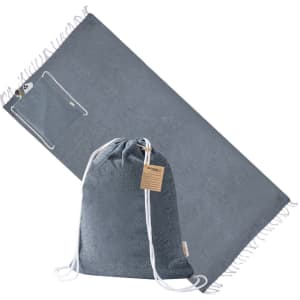 A grey drawstring bag and matching pareo, featuring a small pocket and tasselled edges. The bag has a logo.
