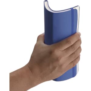 A blue notebook with a smooth cover, held in a hand, featuring a spine and a logo on the front.