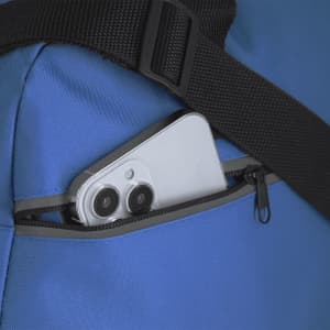 A blue bag features a zippered pocket with a white smartphone partially inserted. The bag has a black strap.