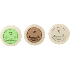 Three circular soap bars in green, brown, and beige packaging, labelled with "Soap 20g," each with a logo.