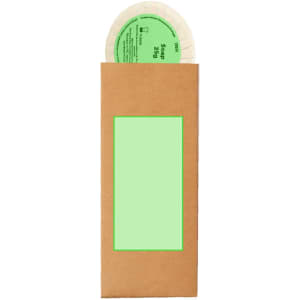A brown paper package containing a round soap wrapped in natural materials, featuring a green label on the front.