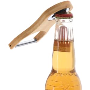 A drink bottle opener with a wooden handle and metal opener, positioned on a bottle cap.