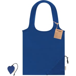 A blue foldable tote bag with a hanging tag and a small matching accessory attached.