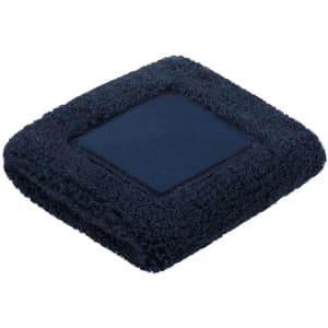 A soft navy blue towel, square-shaped with a textured border and a plush centre.