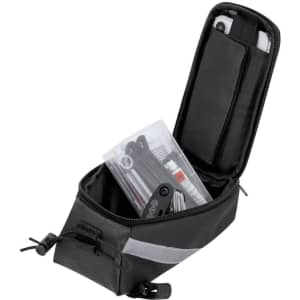 A black bike bag with a zippered opening, containing tools and accessories inside a clear pouch. It features reflective detailing and a logo.