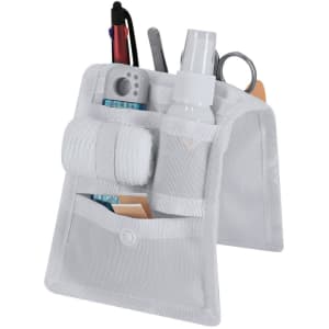 A white nursing organiser featuring multiple pockets for storing pens, scissors, spray bottles, and other small items.