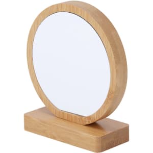 A round mirror with a wooden bamboo frame and a rectangular base. The design is simple and elegant.