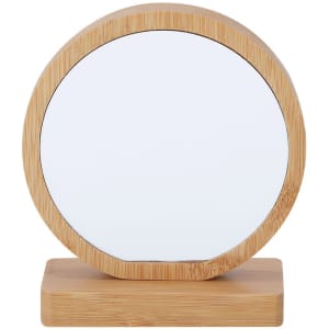 A round mirror with a bamboo frame and base, featuring a simple, sleek design.