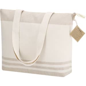 A cream and beige tote bag with a zip closure and a textured design. It features a logo and short handles.