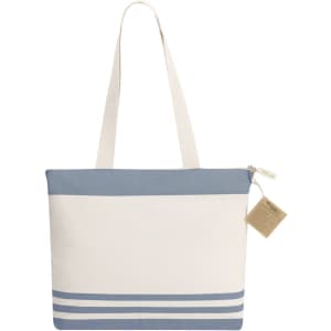 A tote bag in cream and blue, featuring a zip closure and decorative stripes at the base, with a tag attached.