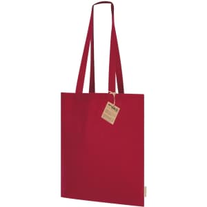 A red tote bag with long handles and a tag attached, featuring a simple, solid design.