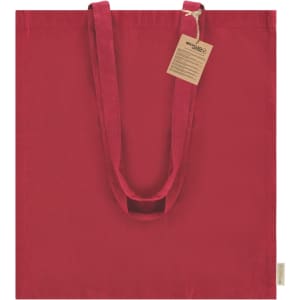 A red tote bag with two long handles, featuring a tag and a branding logo.
