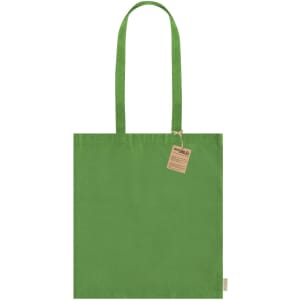A green tote bag with two handles and a tag attached, featuring a simple design.
