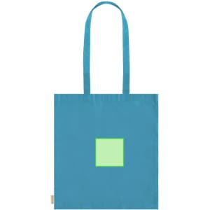 A blue tote bag featuring a green square in the centre and dual handles, along with a logo tag at the side.