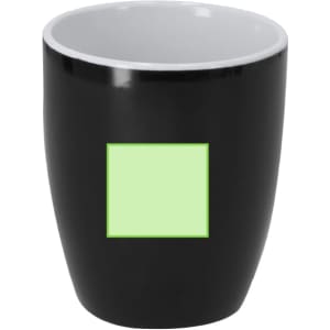 A black ceramic mug with a glossy finish and a light green square area, featuring an interior in white.