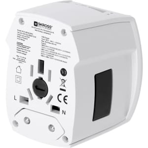 A universal travel adapter in white with multiple outlets and a logo, designed for various plug types.