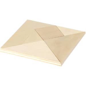 A wooden puzzle featuring various geometric shapes in a light colour scheme, with a flat, smooth surface.