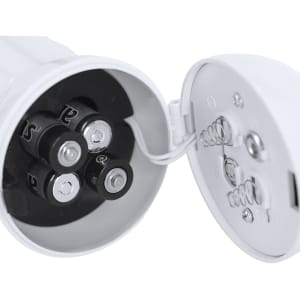 A white megaphone with a battery compartment, showcasing four batteries and internal wiring.