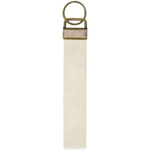 A keyring featuring a brass-finished loop and a long, cream-coloured strap.