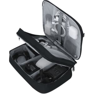 A black organiser case opened to reveal various cables, chargers, and electronic accessories inside.