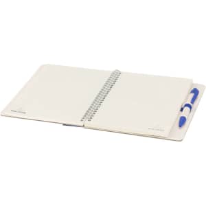 A spiral-bound notebook with blank pages and a blue pen, featuring a subtle logo on the cover.