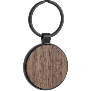 A round keyring with a wood-textured circular pendant and a black metal ring. The item features a logo.