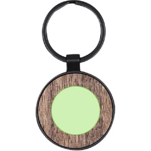 A round keyring with a wooden texture and a green circle in the centre, featuring a black attachment.
