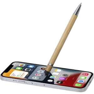A bamboo stylus pen resting on a smartphone screen, featuring a metallic tip and a sleek design.