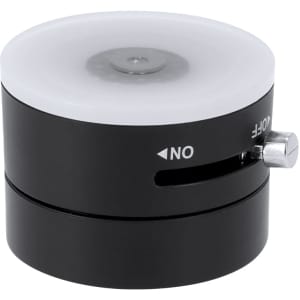 A black and white circular device with a switch labelled 'ON/OFF', featuring a translucent top. It has a branding logo.