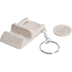 A cream keyring holder with a circular coin attachment, featuring a textured surface and a metal chain.