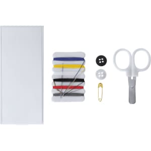 A sewing kit with a white box, colourful threads, buttons, a safety pin, and a pair of scissors.
